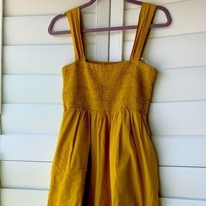 Oversized yellow jumpsuit with straps